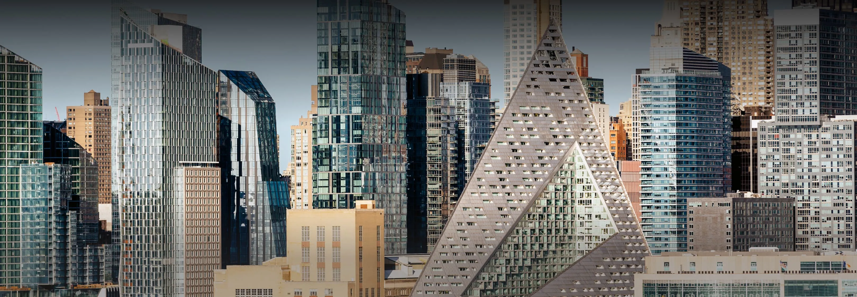 Diverse architecture in a dense urban skyline with a the VIA 57 WEST building as the focal point.